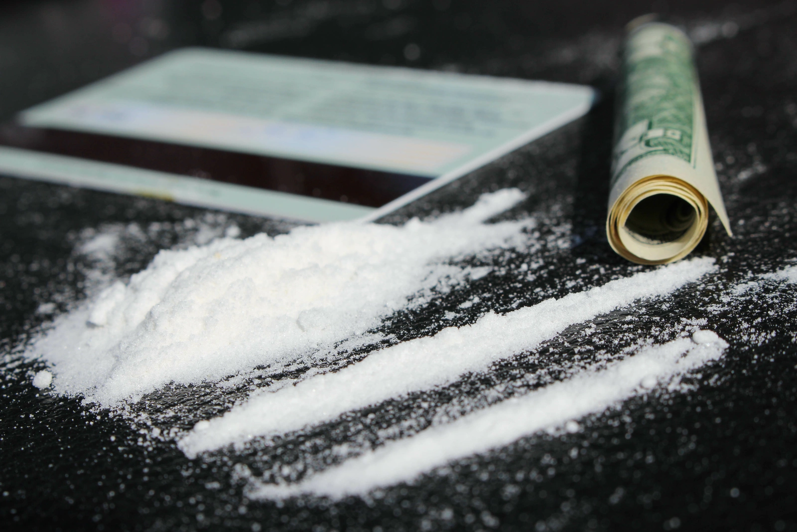 Cocaine on Table with Rolled Dollar and Credit Card